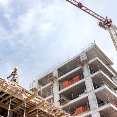 A new building is being constructed with use of tower crane